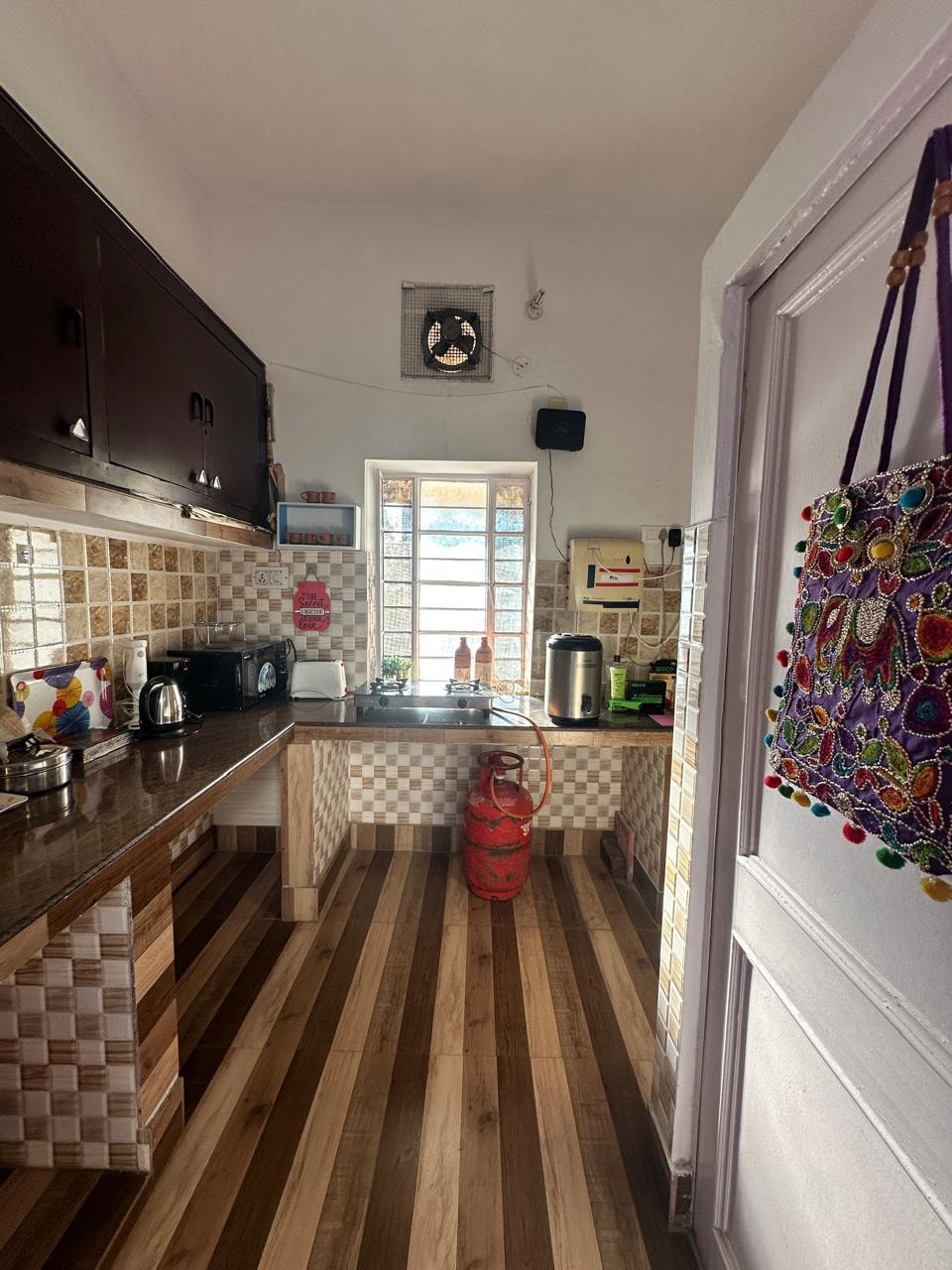 Kitchen — full view with colourful Rajasthani bag